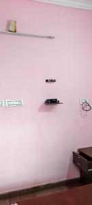 a white wall with a shelf on it at Banasura Green paradise , Villa , Deluxe rooms , Budget rooms in Padinjarathara +79 photos