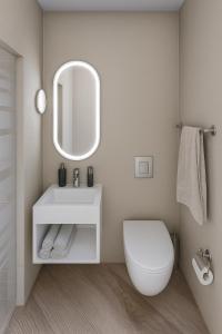 une salle de bain avec des toilettes blanches et un miroir dans l'établissement VISIONAPARTMENTS Leonhardstrasse - contactless check-in, à Zurich
