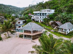 an aerial view of a house on the beach at Beach Front Cabana 1, Puraran Surf Resort in Sampong