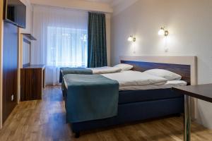 Postel nebo postele na pokoji v ubytování Pirita Beach Apartments & SPA