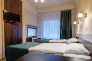 TV a/nebo společenská místnost v ubytování Pirita Beach Apartments & SPA
