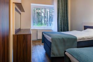 Postel nebo postele na pokoji v ubytování Pirita Beach Apartments & SPA