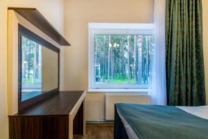 Postel nebo postele na pokoji v ubytování Pirita Beach Apartments & SPA