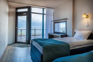 Postel nebo postele na pokoji v ubytování Pirita Beach Apartments & SPA + 37 fotografií