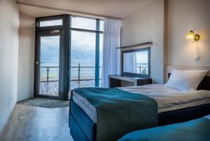 Кровать или кровати в номере Pirita Beach Apartments & SPA