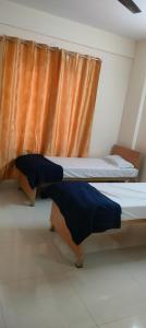 Una cama o camas en una habitación de SaiBalajiCoLivingPG