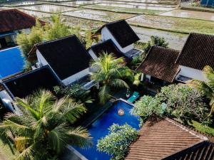 an aerial view of a resort with a swimming pool at Sundhara View Ubud in Ubud