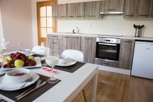 Kuchyň nebo kuchyňský kout v ubytování Villa Grande - Apartmány