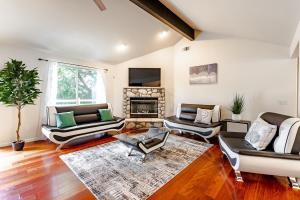 a living room with couches and a fireplace at Yosemite and Bass lake I Hot tub I Game room I Sleeps 13 in Oakhurst