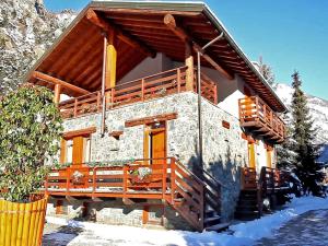 a log cabin in the snow in front at Alpine Bliss A Cosy Retreat in Antey-Saint-André +32 photos