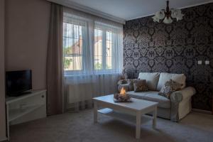 TV a/nebo společenská místnost v ubytování Villa Grande - Apartmány