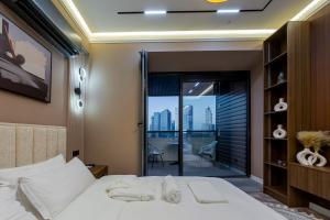 Ένα ή περισσότερα κρεβάτια σε δωμάτιο στο U-Tower City View Apart