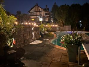 a house with a swimming pool at night at The Highland Oasis in Ephrata