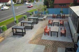 a group of tables and chairs and a street at Abbots Hamilton – Hotel and Conference Centre in Hamilton