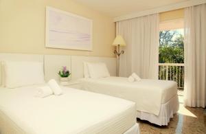 Cama ou camas em um quarto em KS Beach Hotel