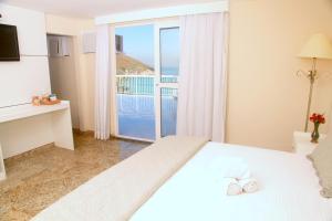 Cama ou camas em um quarto em KS Beach Hotel