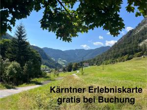 a road in the mountains with the words kimmer eridisete grains be at Ferienwohnung Storck in Bad Bleiberg