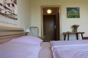 Postel nebo postele na pokoji v ubytování Haus Luca Seeblick