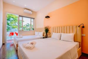 Postel nebo postele na pokoji v ubytování An Homestay Lakeview Apartment