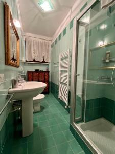 a bathroom with a sink and a shower at Chez Francois Lazise Pool in Lazise +14 photos