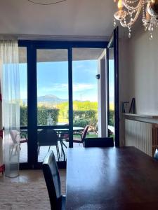 a dining room with a table and a view at Chez Francois Lazise Pool in Lazise