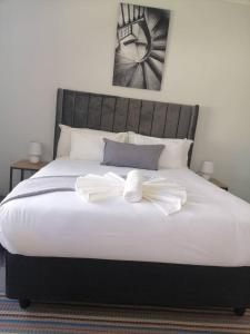 Katil atau katil-katil dalam bilik di Moxwini Self Catering Apartments