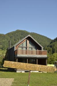 a house with a sign in front of it at Ambar House in Krivorovnya