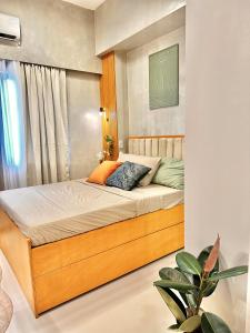 a bedroom with a bed in a room at WV Tower 2 Condo Sage Unit in Iloilo City