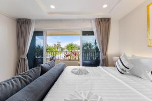 Giường trong phòng chung tại The Terraza A302 Studio Apartment +50 ảnh