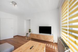 Televisyen dan/atau pusat hiburan di Ferienwohnung am Geiseltalsee