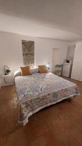 a bedroom with a large bed in a room at La Casetta Sulle Mura in Santarcangelo di Romagna