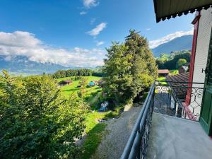 a balcony of a house with a view of a valley at zentrumRANFT in Flüeli