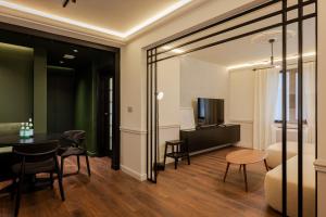 a living room with a table and a dining room at Private Premium Apartment in Plovdiv in Plovdiv