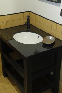 a black counter with a sink in a bathroom at Frank86 in Băile Tuşnad +35 photos