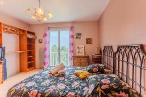 a bedroom with a bed and a window at Gite Gousseau in Buzy