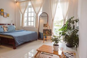 Кровать или кровати в номере Ichigo Home Đà Lạt