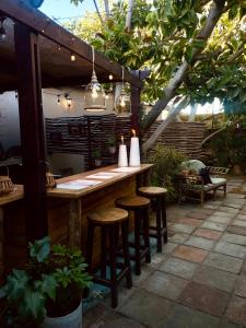 a bar on a patio with stools around it at Swakopmund Backpackers in Swakopmund