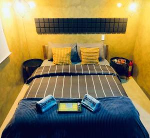a bedroom with a large bed with two pillows at Casa Karina in Camp Wilhelm