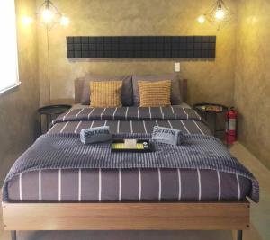 a bed with two pillows on it in a bedroom at Casa Karina in Camp Wilhelm +66 photos