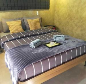 a large bed with two pillows on top of it at Casa Karina in Camp Wilhelm