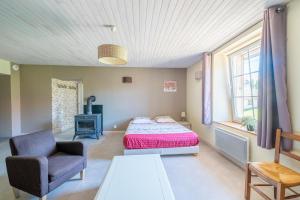 Postel nebo postele na pokoji v ubytování La Maison des Bailly - Maison pour 12p