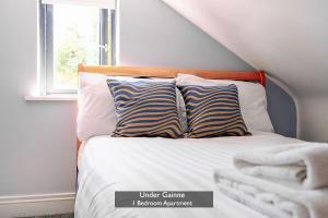 Ένα ή περισσότερα κρεβάτια σε δωμάτιο στο Under Gainne #2