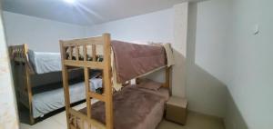 a bedroom with two bunk beds in a room at Departamento jaspe in Cajamarca