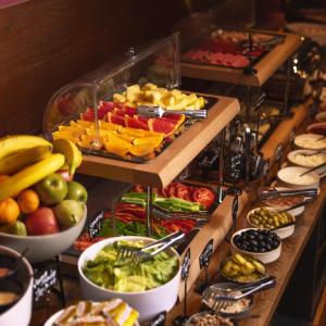 a buffet with many different types of fruits and vegetables at Dialog Kokhta in Bakuriani