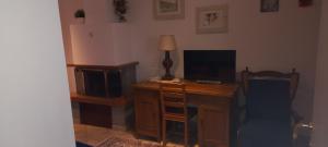 TV a/nebo společenská místnost v ubytování Casa Nelle Corti