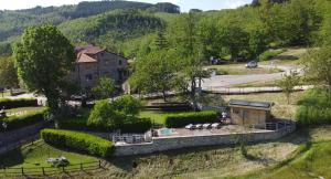 an aerial view of a house in a field at Agriturismo Vezzano in Chiusi della Verna