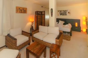 a living room with a couch and chairs and a bed at WELCS APARTAMENTO 284 PDA con terraza y vistas in Caserío Bufagañas +44 photos