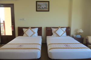 Postel nebo postele na pokoji v ubytování TIEN DAT MUI NE Resort & Spa