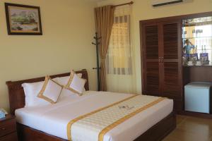Postel nebo postele na pokoji v ubytování TIEN DAT MUI NE Resort & Spa