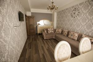 a living room with a couch and a table at Compassrose in Mekhrably